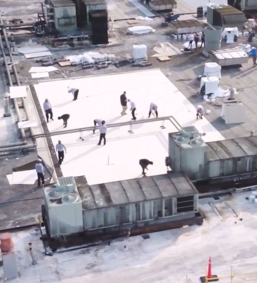 crew installing a flat roof