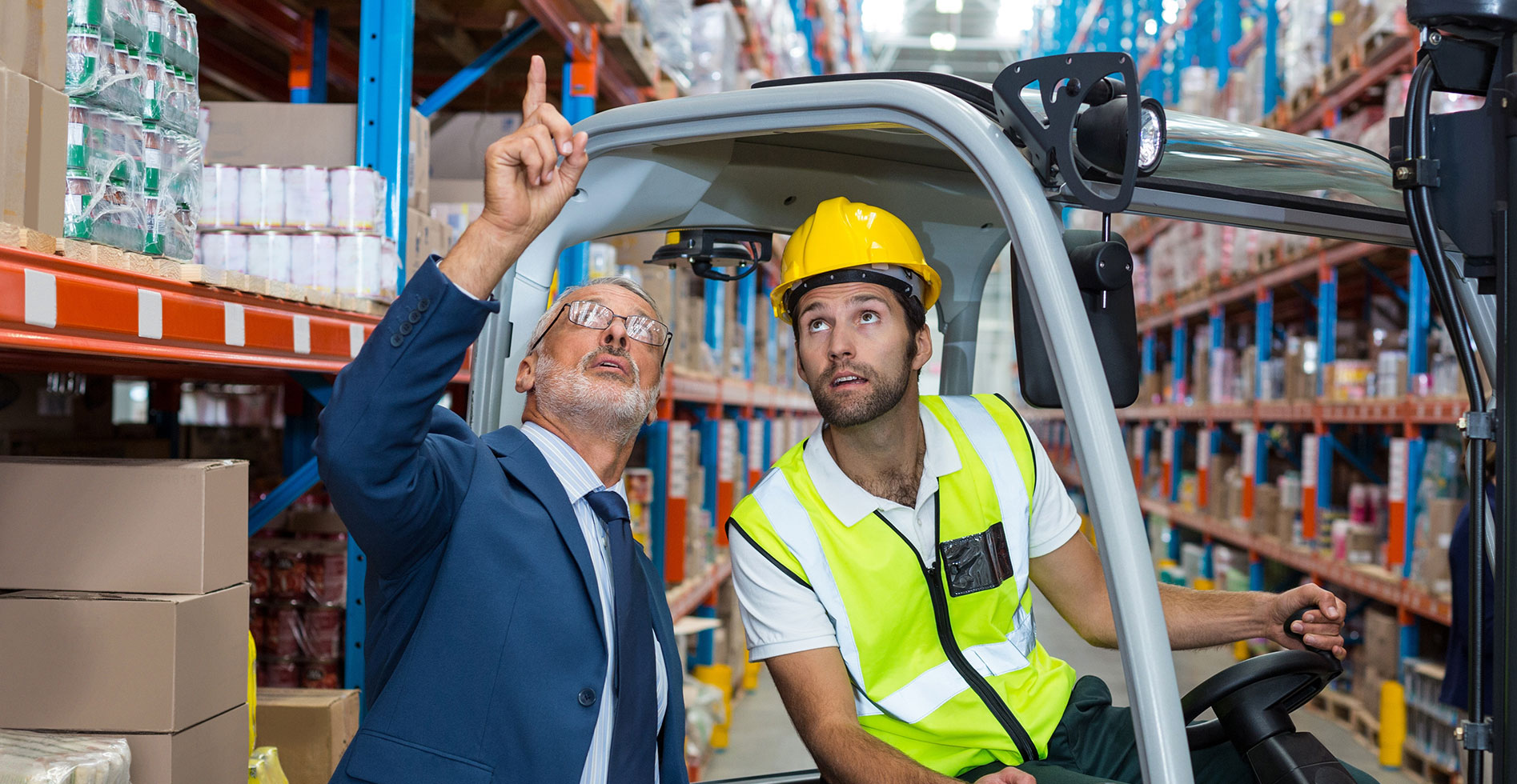 two men looking up at a roof