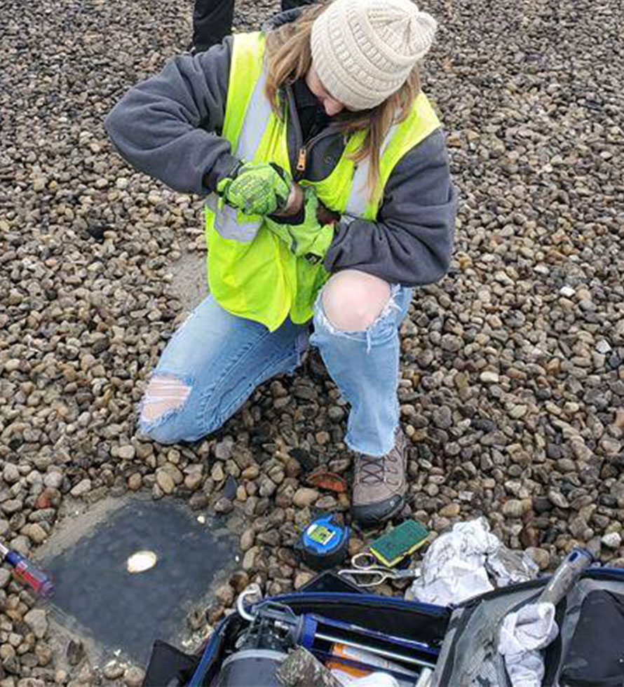 female commercial roofing tech at work