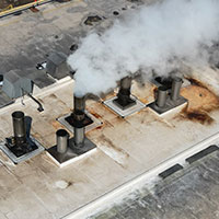 chemical damage to roof membrane around exhausts 