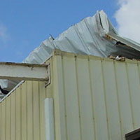 metal roof damaged by wind