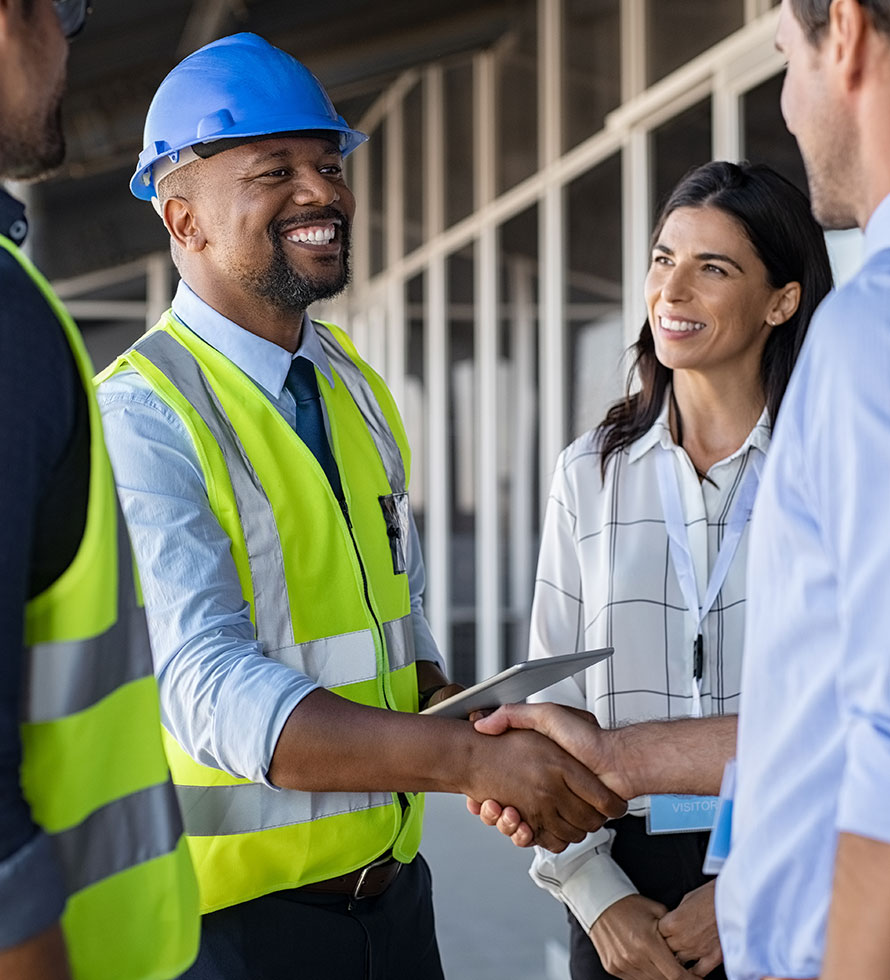 roofer shaking hands with customer