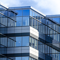 glass office building on a sunny day