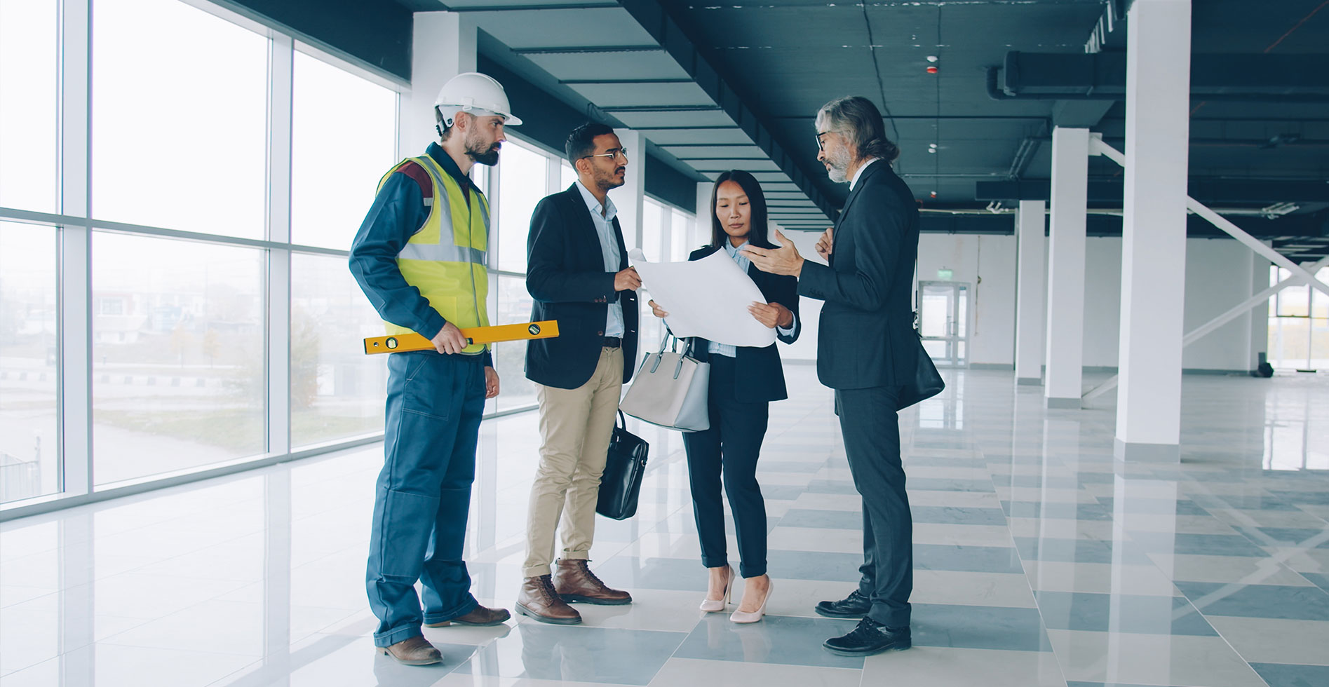 group of property managers looking at drafts