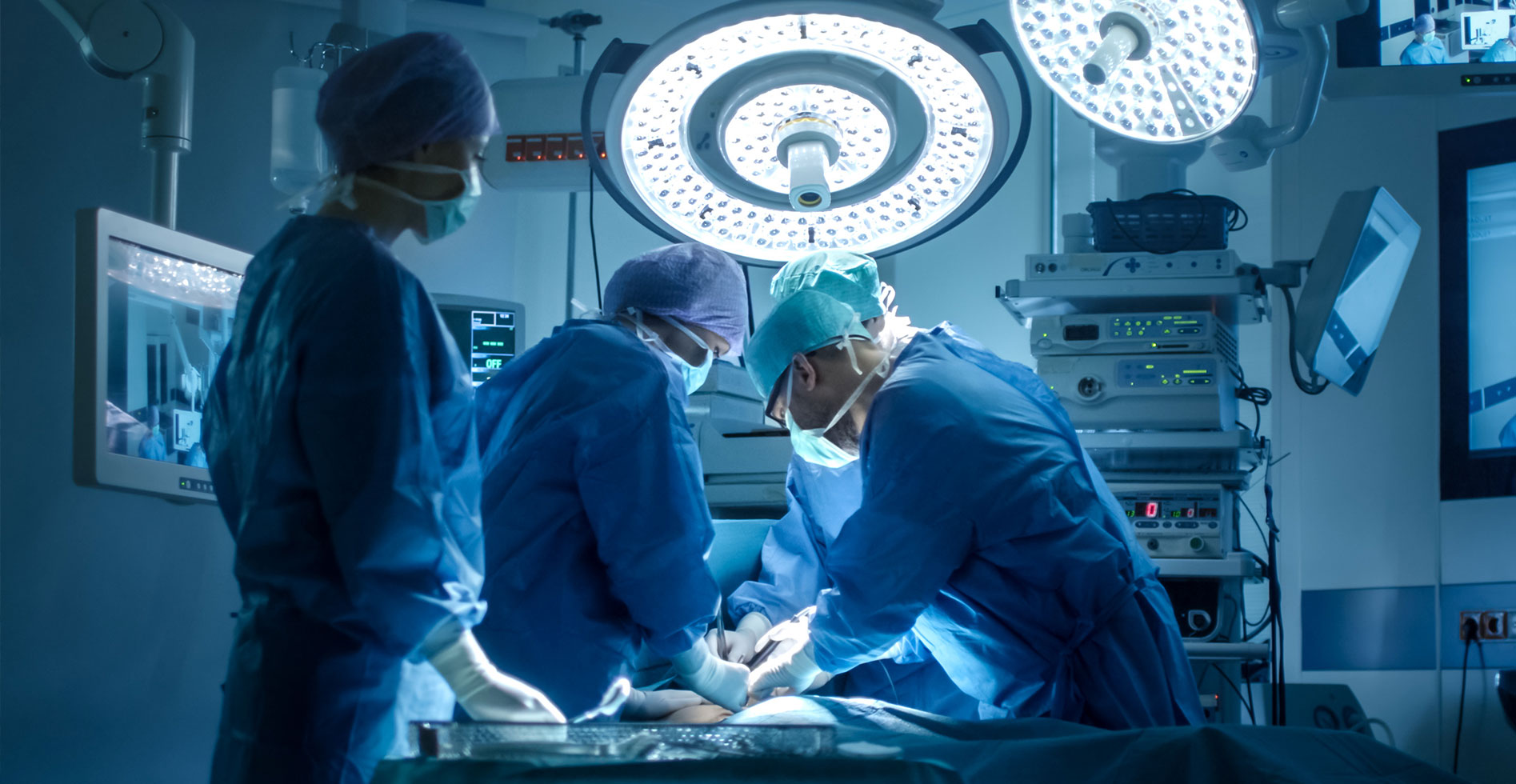 surgeons working on a patient