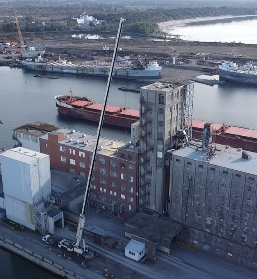 a panoramic view of a mill by lake Erie