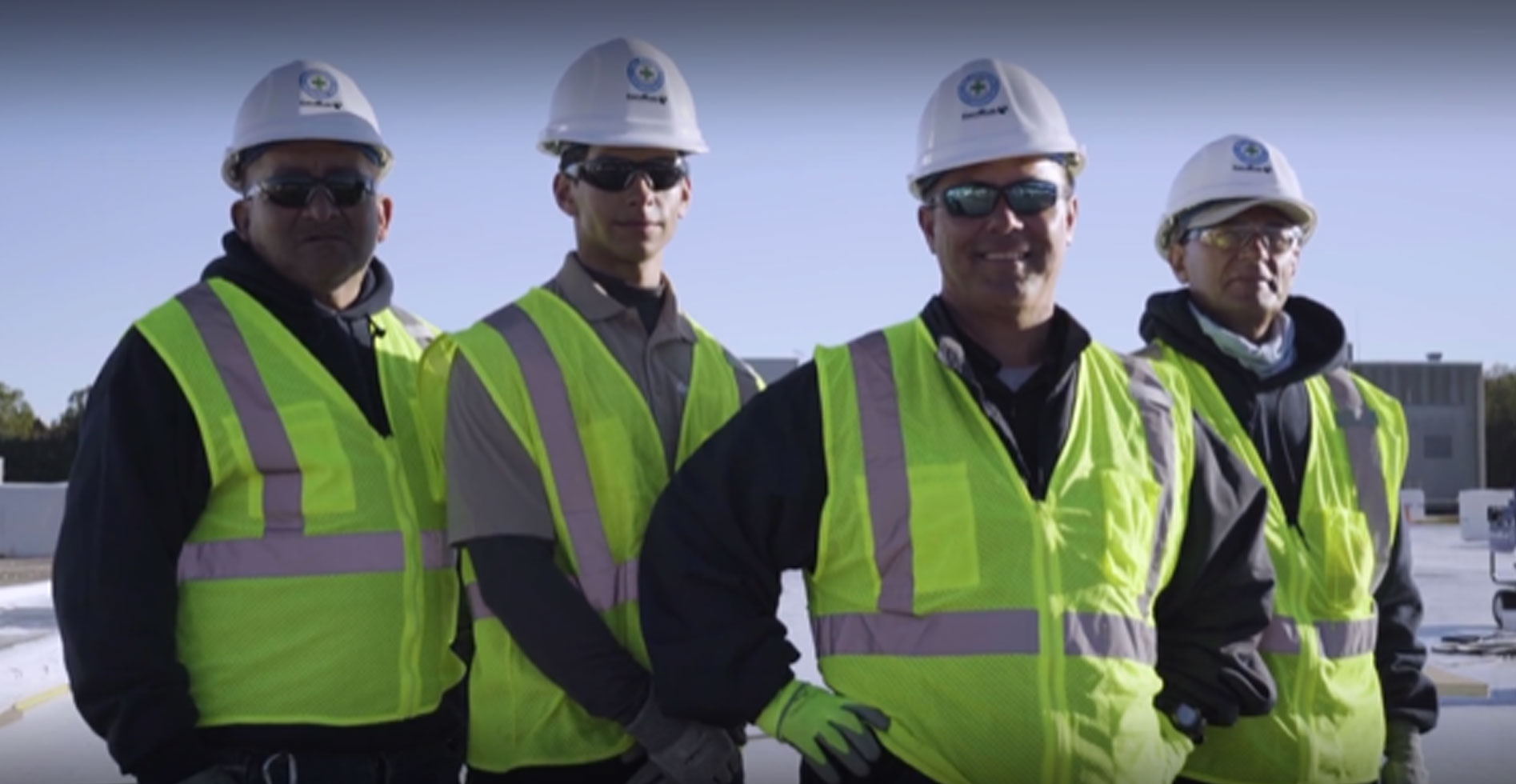 three roofers looking at the camera