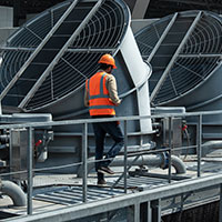 worker walking industrial roof